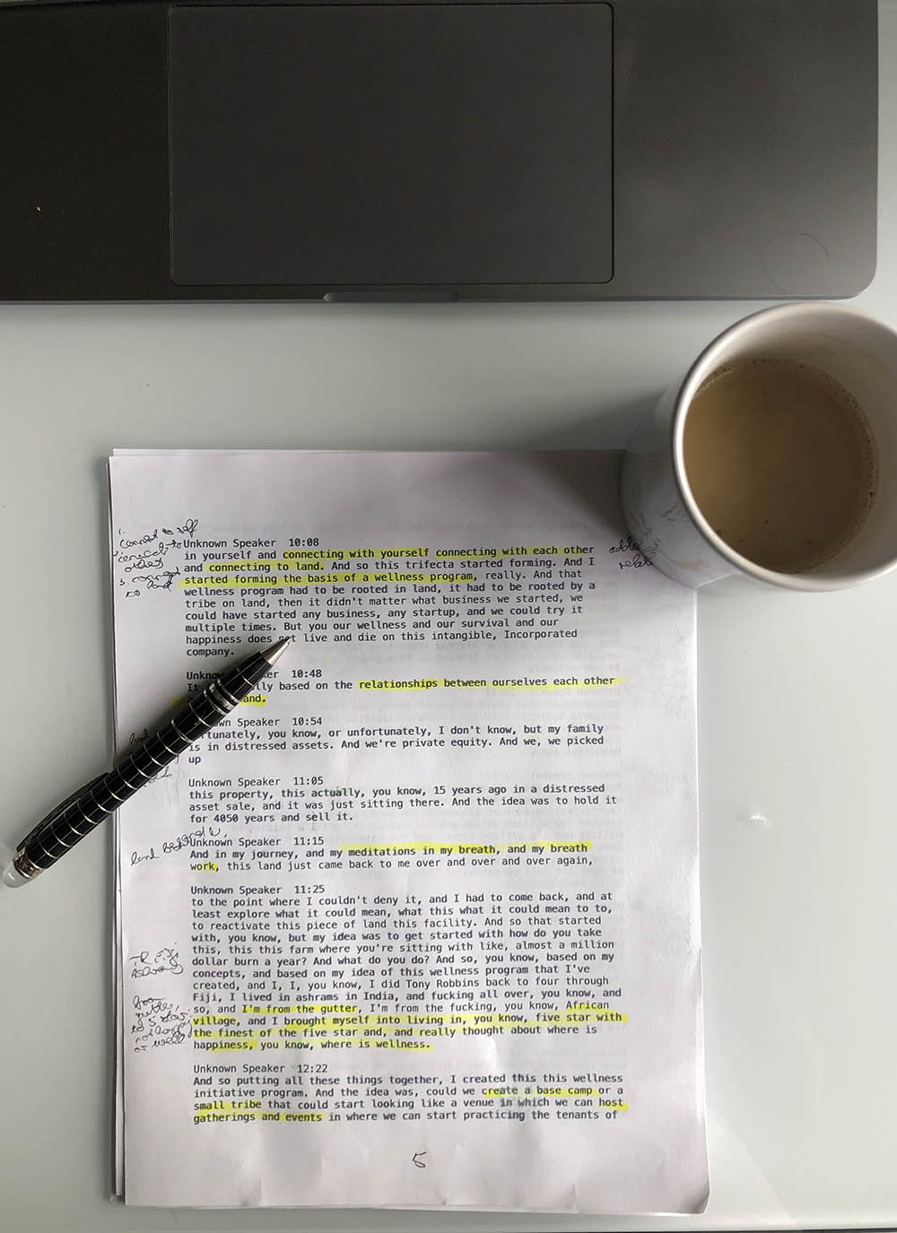 Annotated storyfinding notes beside a cup of coffee